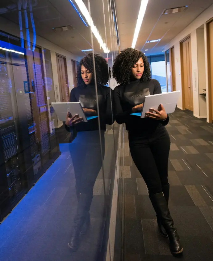 woman in black top using Surface laptop